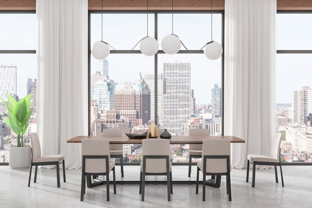 Stylish Manhattan living room with NYC skyline view — cleaned by Bright & Fresh